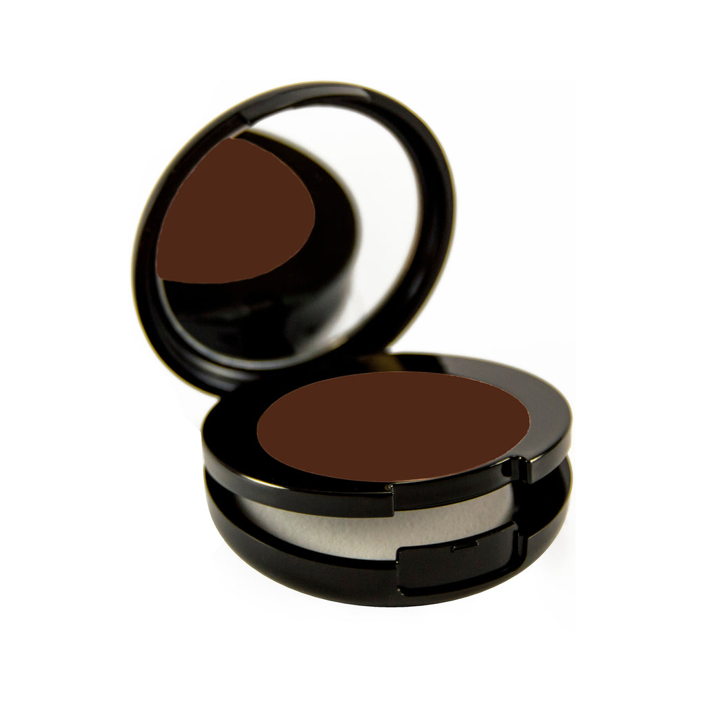 Raven Petite Bio-Fond Compact. Round black mirrored compact with a compartment for a makeup sponge under the makeup.