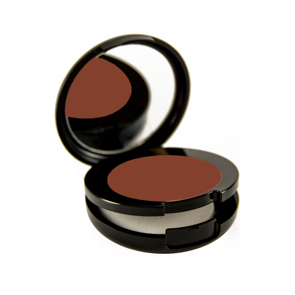 Sable Petite Bio-Fond Compact. Round black mirrored compact with a compartment for a makeup sponge under the makeup.