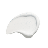 White cream skincare swatch with blue speckles on a white background
