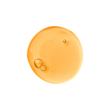Orange-colored liquid droplet with bubbles on a white background
