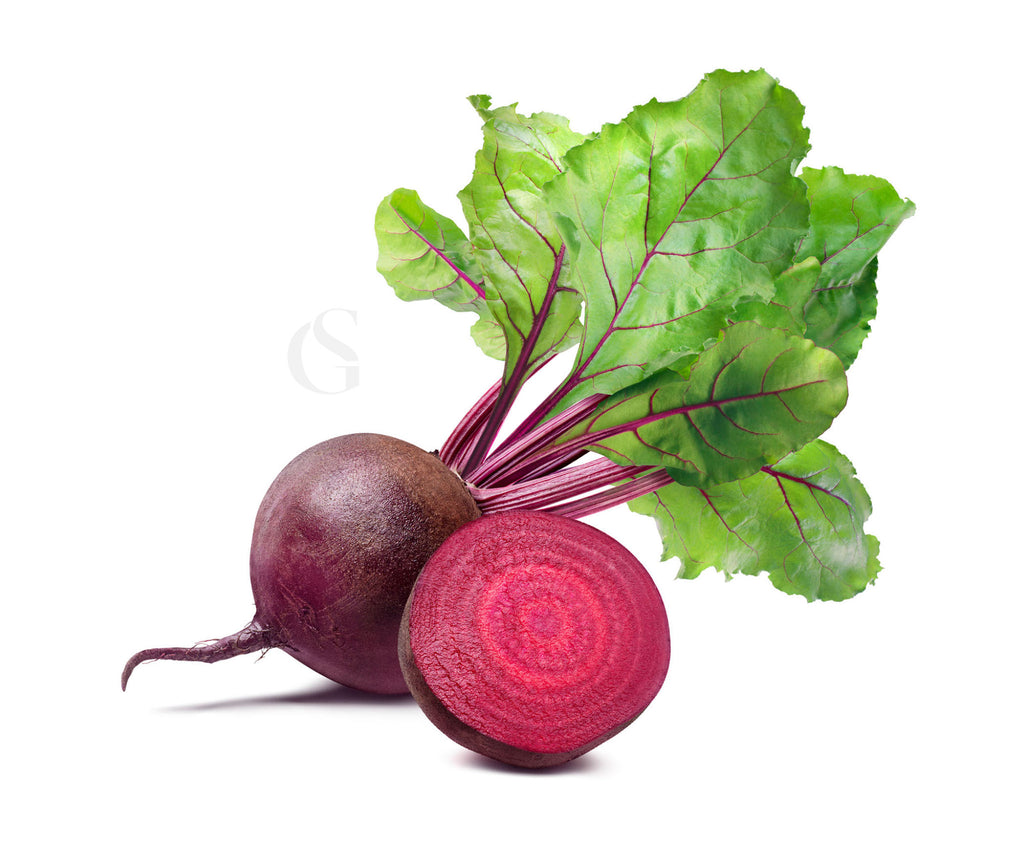 whole beet root and attached leaves with halved beet in front with a white background