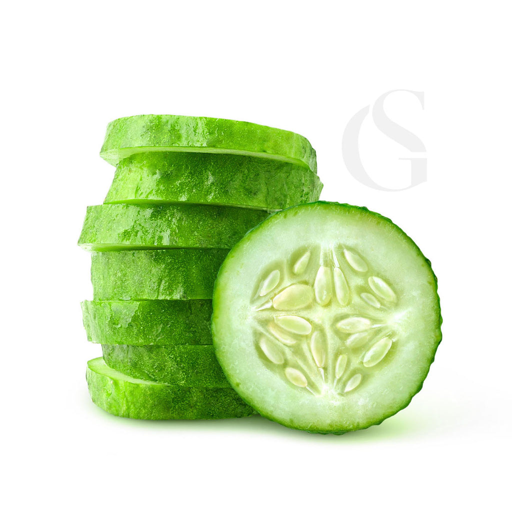 stack of cucumber slices with one cross section in front, white background