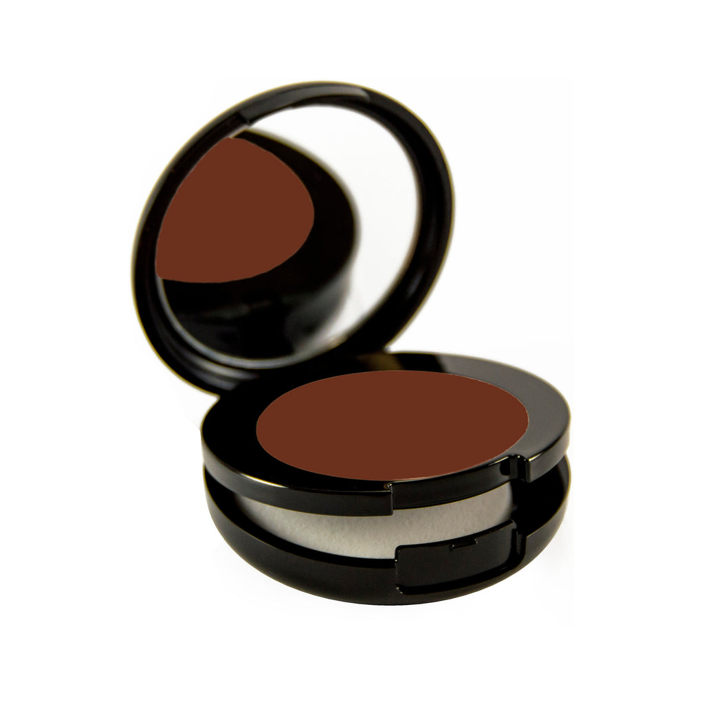 Mahogany Petite Bio-Fond Compact. Round black mirrored compact with a compartment for a makeup sponge under the makeup.