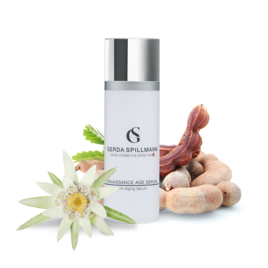 Skincare serum bottle with decorative elements on a white background